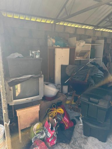 Garage Clearance - Before Cluttered garage before clearance